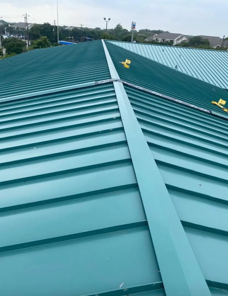 Green commercial metal roof ridge and valley for Metal Roof Repair in Harvey